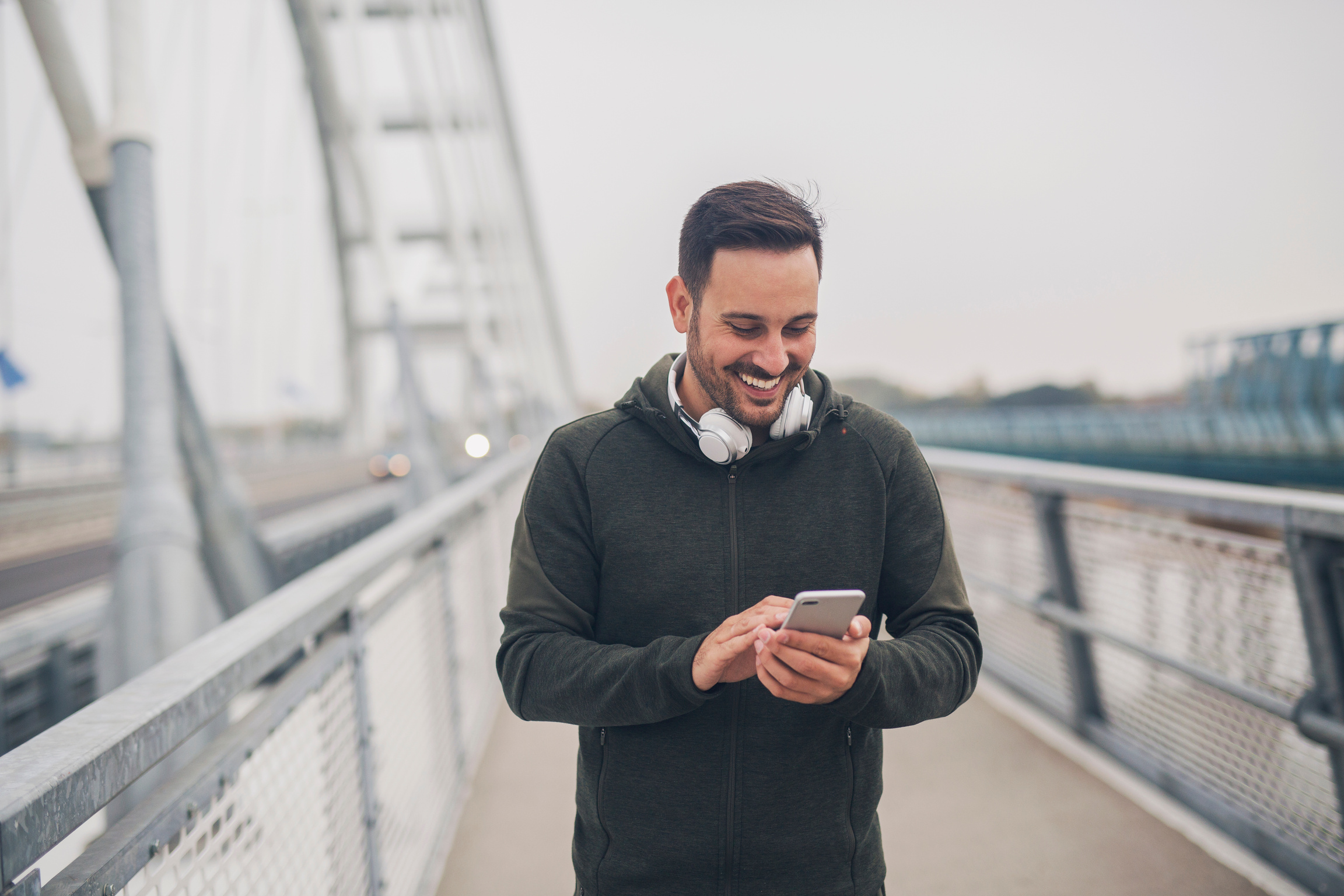 Sporty man checking phone