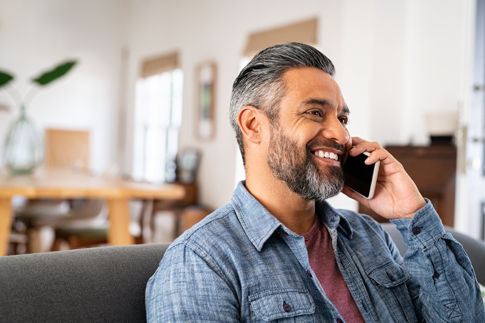 Happy Mid Aged Man Talking on Phone